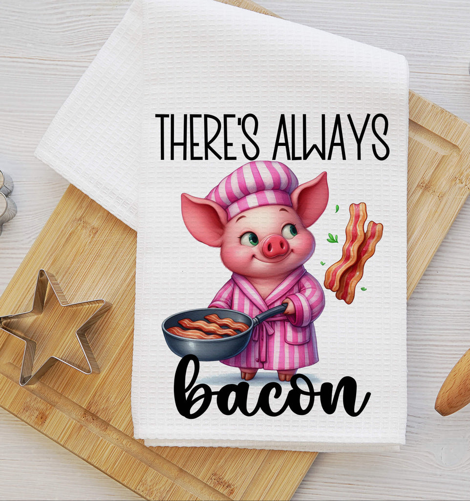 Charming kitchen towel featuring an adorable pig chef in pink pajamas flipping bacon in a frying pan, with the phrase Theres Always Bacon Perfect for farmhouse kitchens rustic decor, and bacon lovers - Personalized Kreation