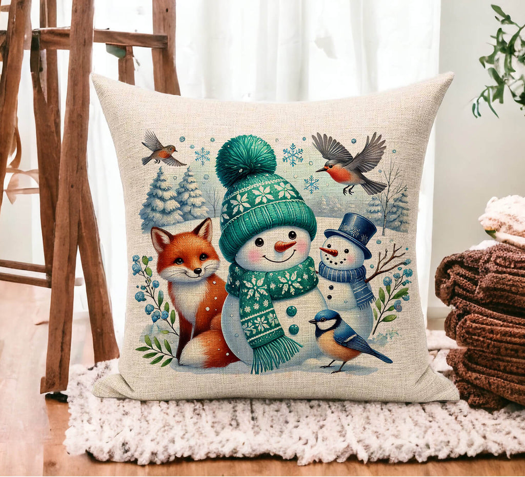 Decorative pillow with winter-themed design featuring a snowman, fox, and birds on a wooden floor.