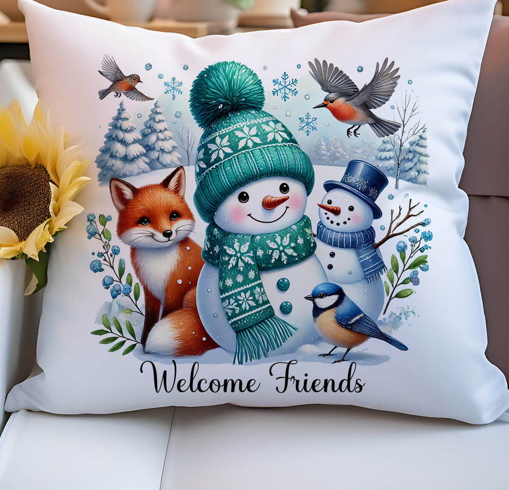 Decorative pillow with a snowman, fox, and birds design on a couch.